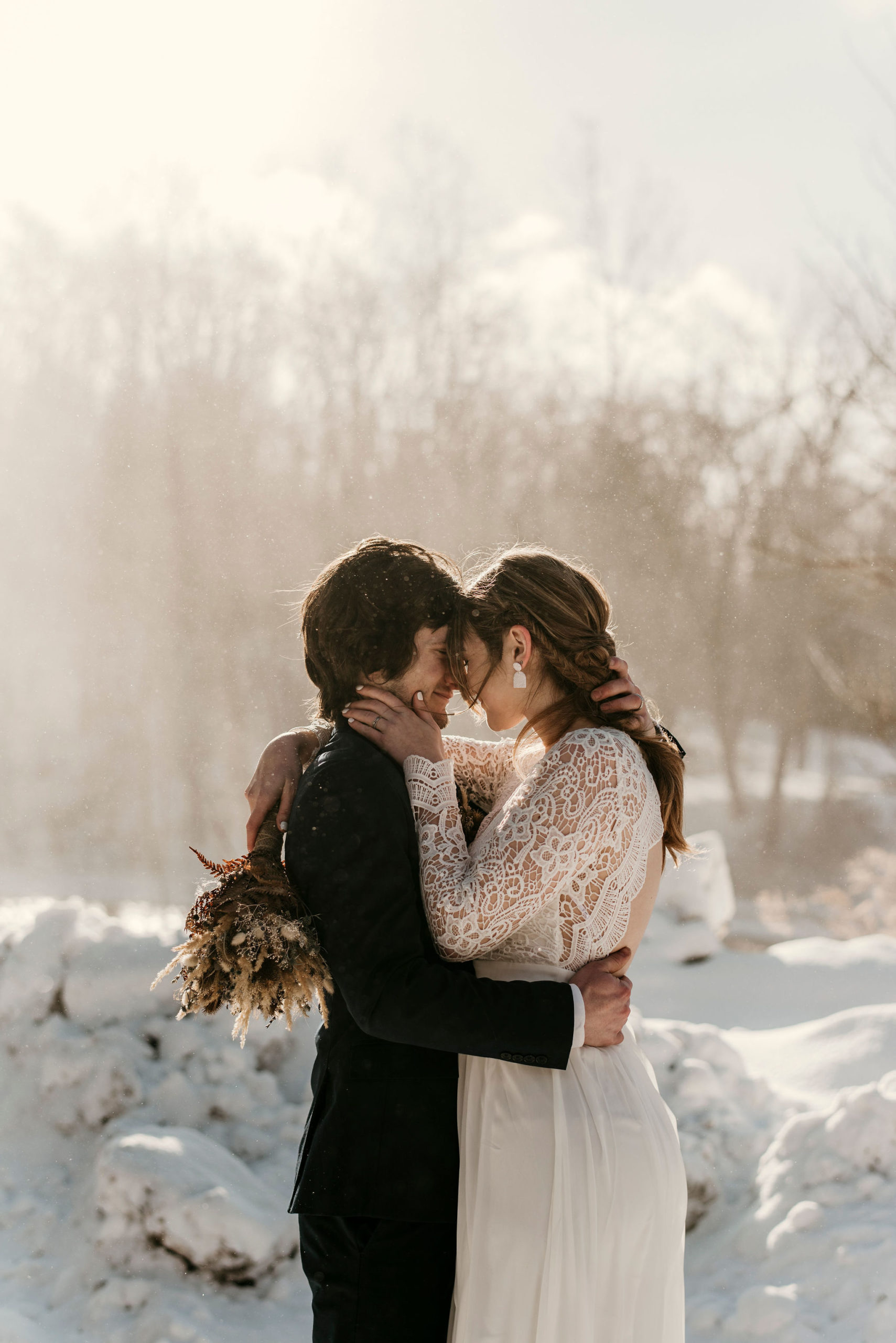 bride and groom kissing in the snow | Tips For Your New York Winter Engagement or Elopement