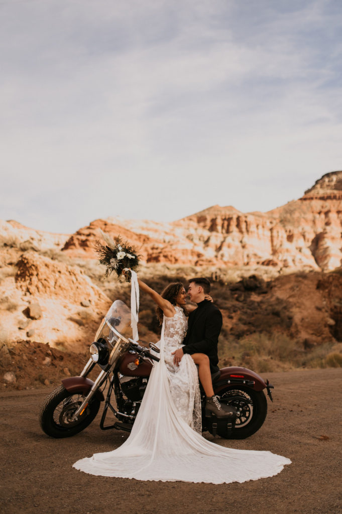 Couple sitting on motorcycle for elopement photos taken by Nicole Adrianna Elopement Photographer