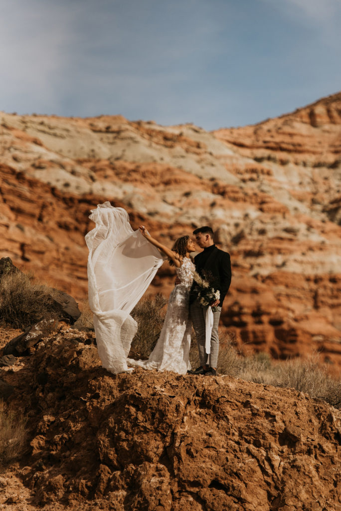 Couple posing for elopement photos taken by Nicole Adrianna Elopement Photographer