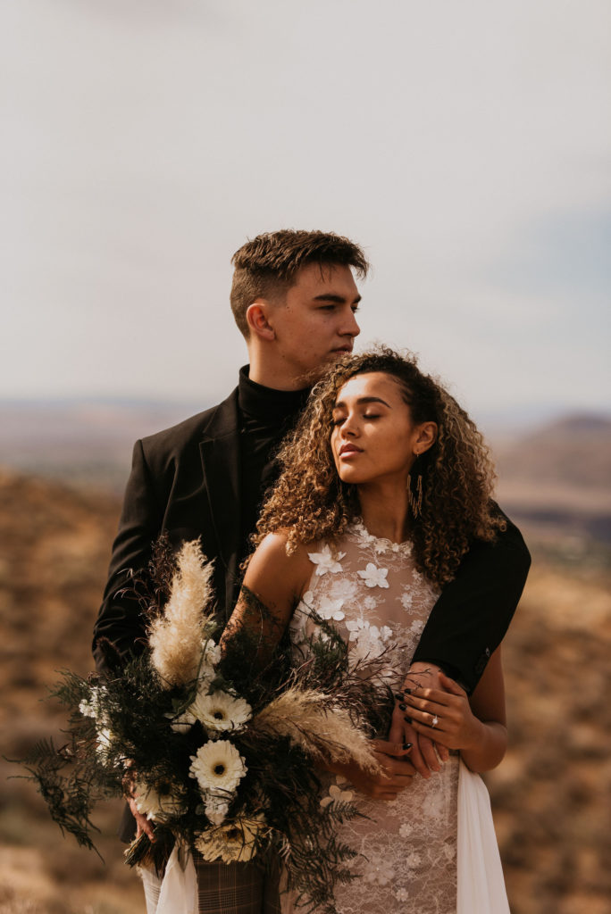 Couple posing for photos in the Utah desert