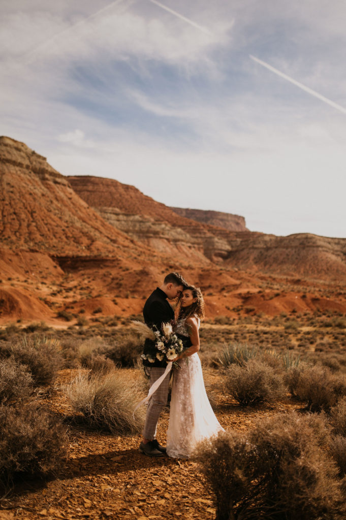 Couple posing for photos in the Utah desert