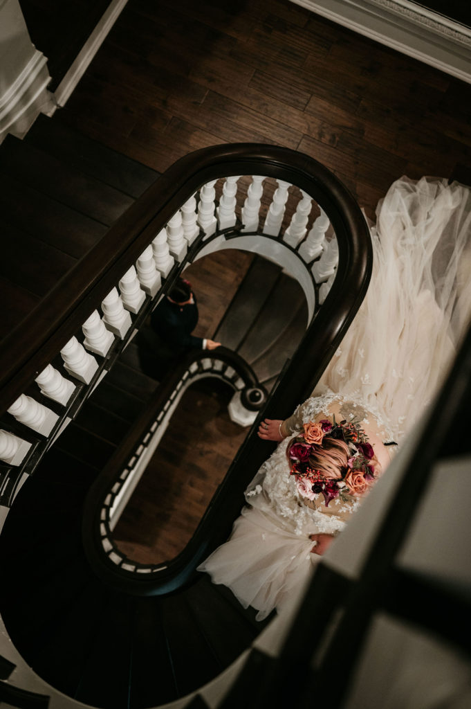 Bride going down stairway
