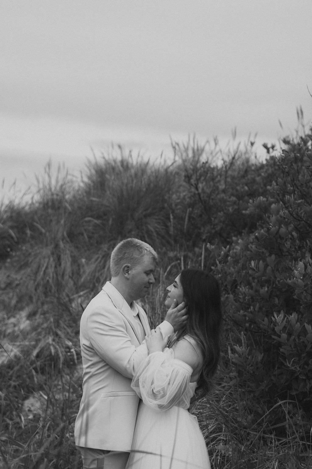 Bride at Groom during first look at beach elopement location at Manzanita Oregon.