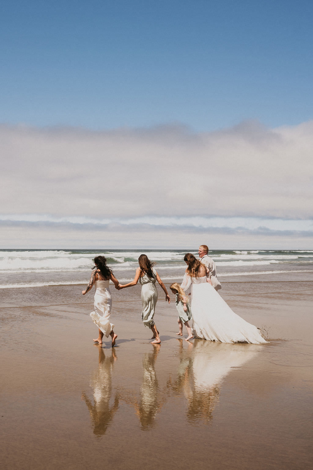 Celebrating their elopement by going into the water with their family.