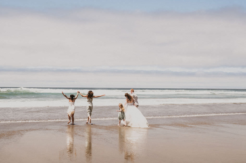 Celebrating their elopement by going into the water with their family.