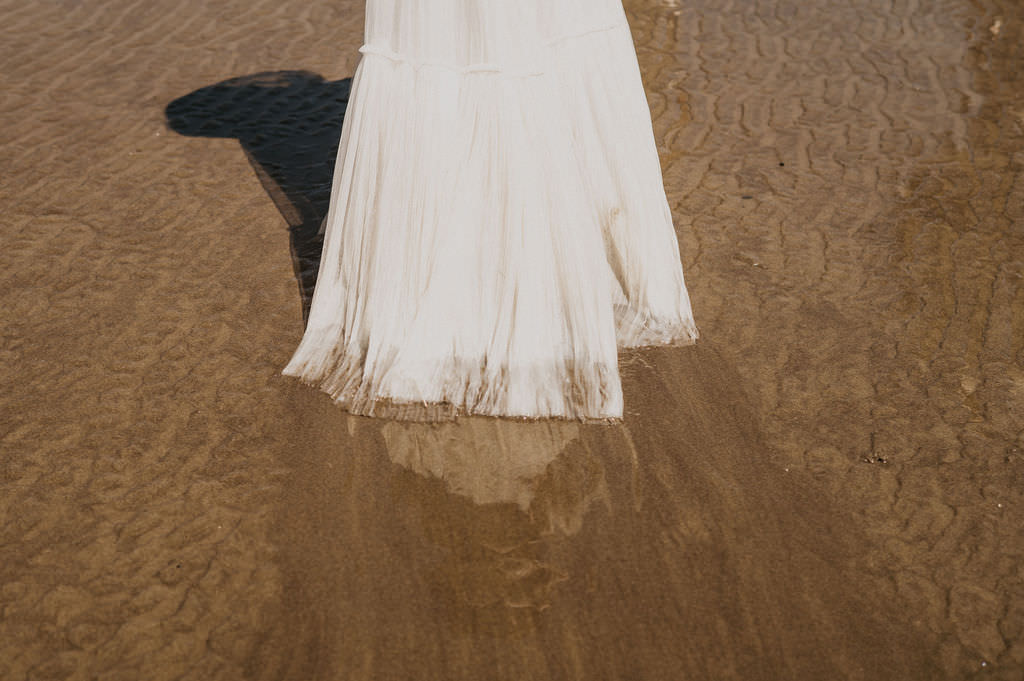Brides dress by the end of her elopement.