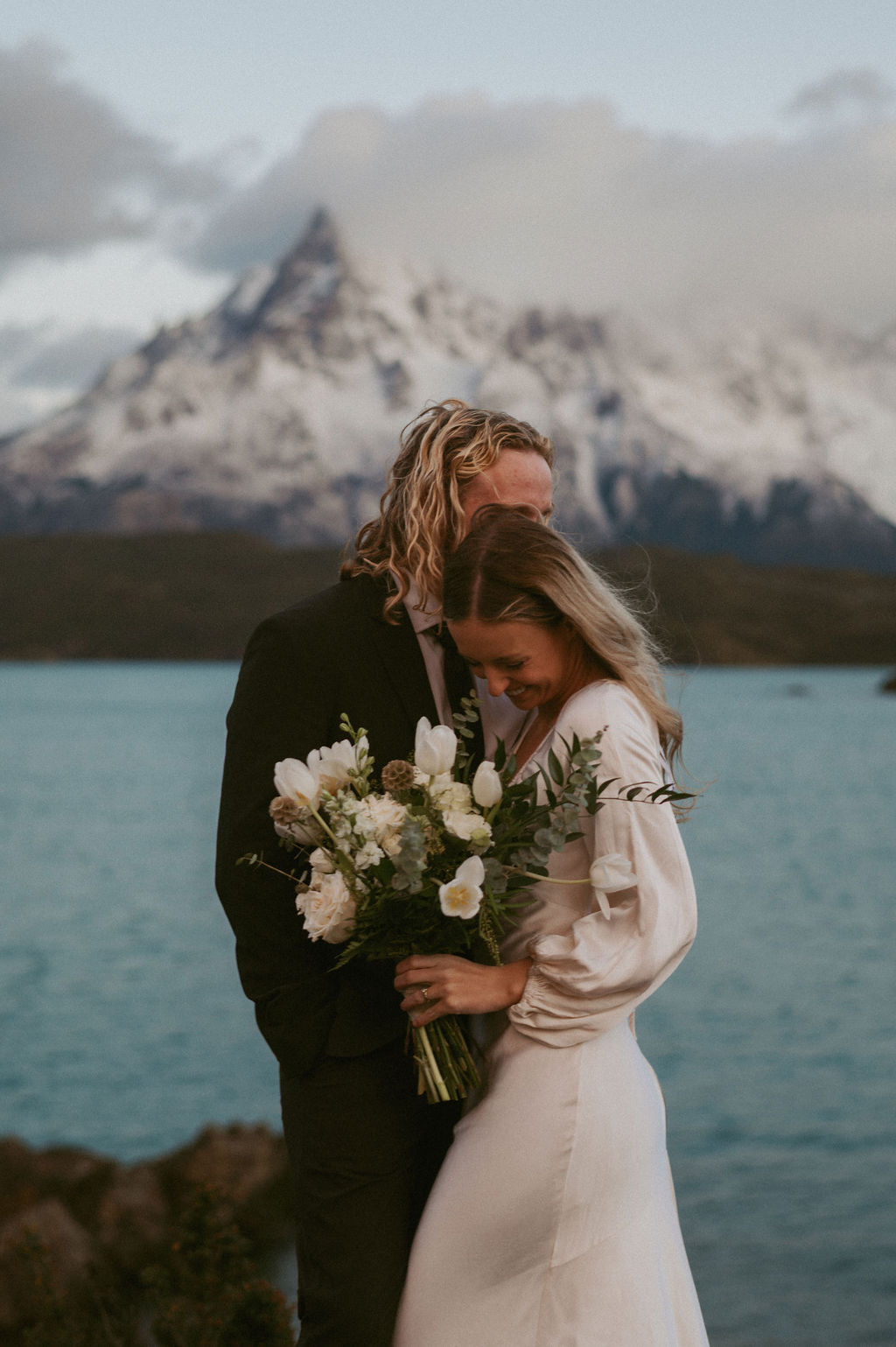Couple sharing a candid moment during their intimate Patagonia elopement.