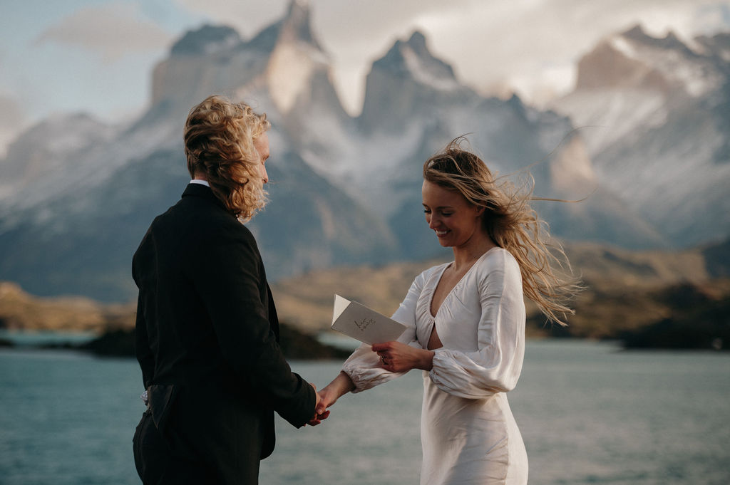 Couple exchanging vows on a Patagonia cliffside.