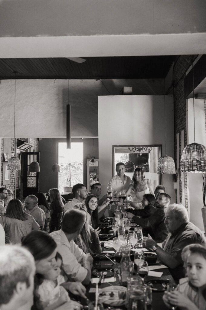 Family dinner celebration included in an elopement timeline, capturing a relaxed wedding evening together.