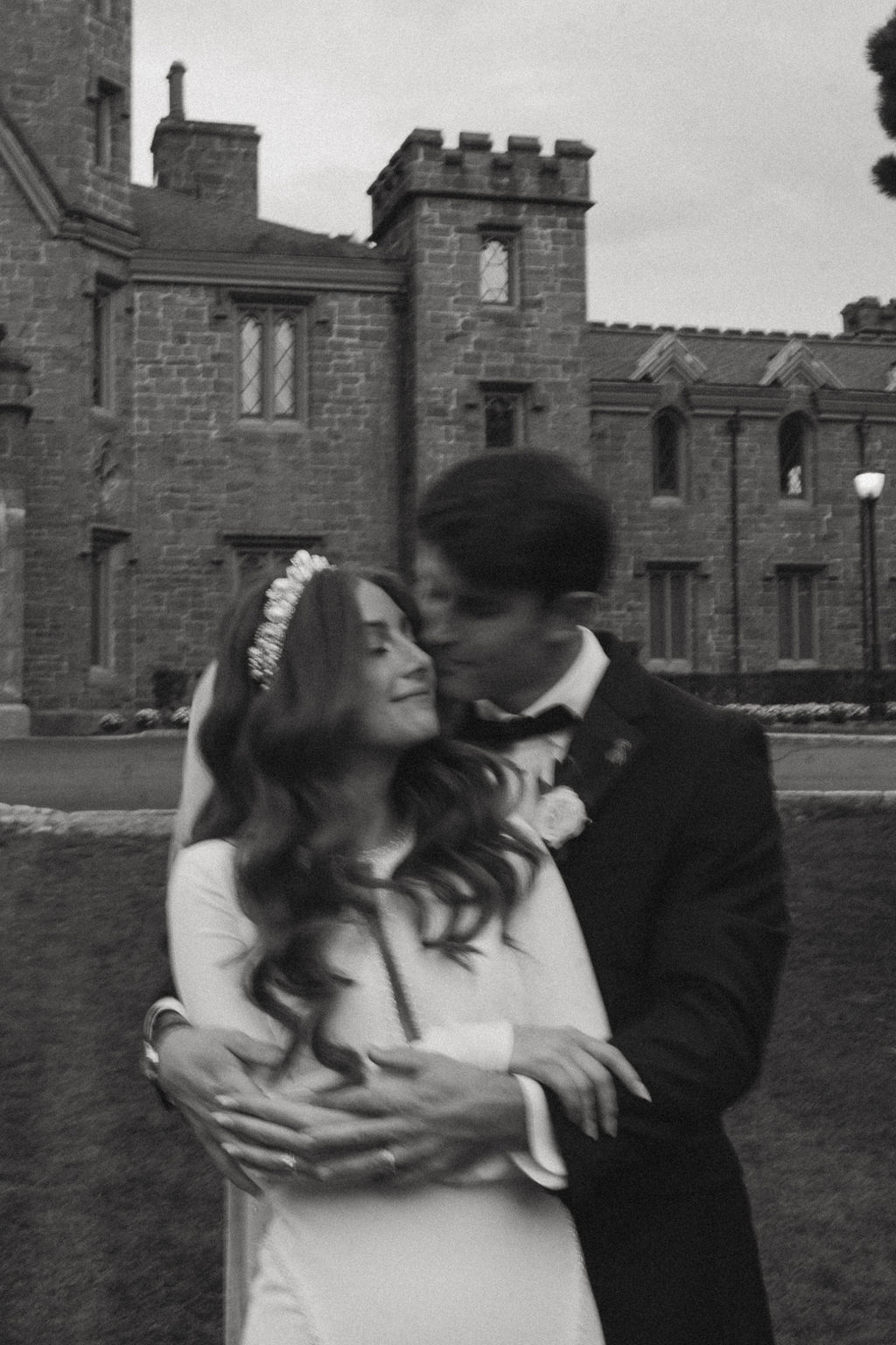 Motion blur couple embracing during their wedding day portraits—documentary style photography.
