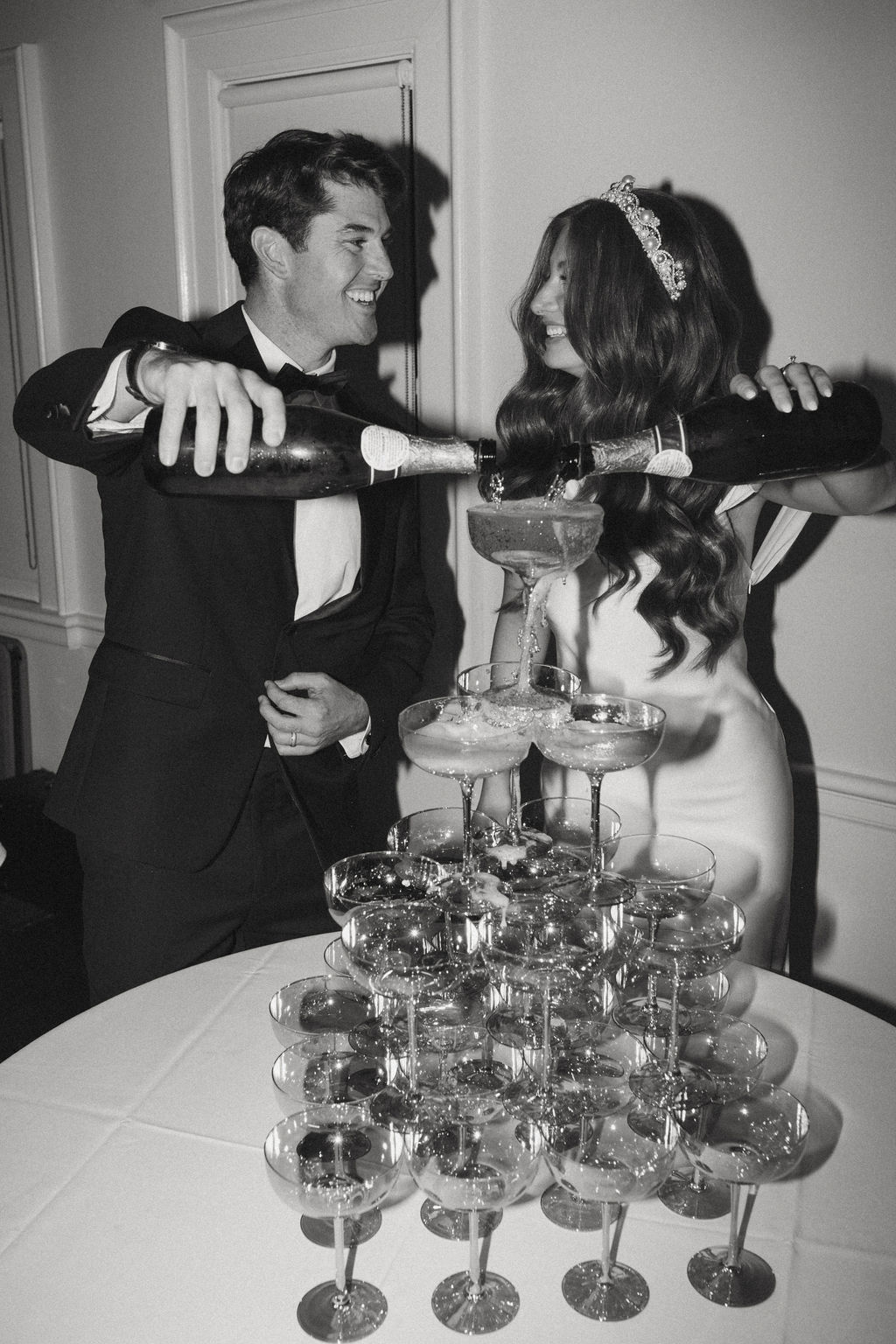 Champagne tower at a traditional wedding.